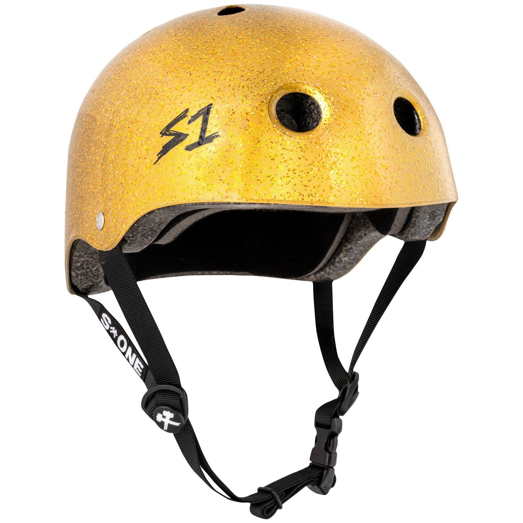 The yellow glittery S-One Helmet Lifer Gold Glitter features black straps, ventilation holes, and an "S1" logo. This multi-impact helmet includes an adjustable chin strap for added security.
