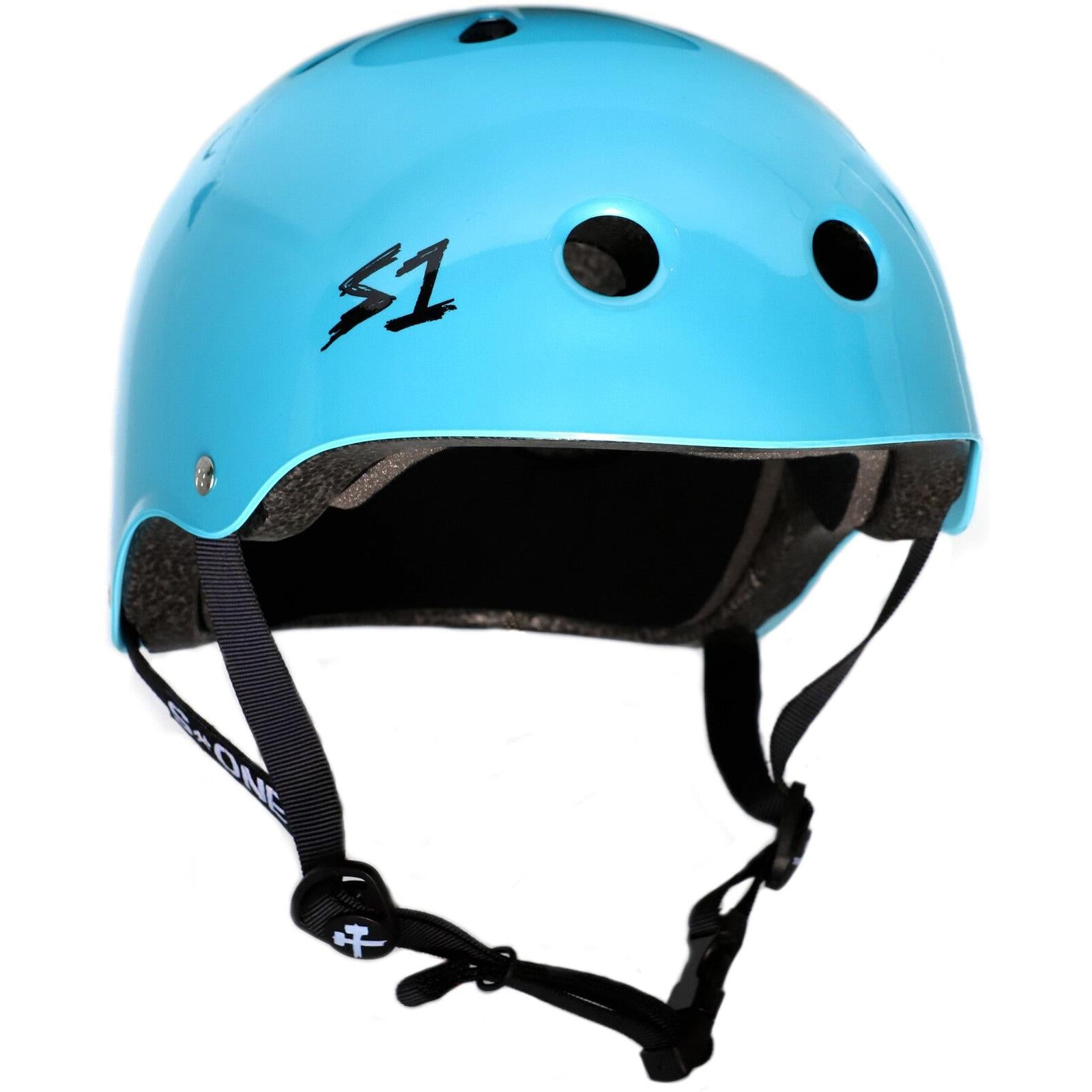A blue S-One Helmet Mini Lifer Light Blue Metallic Gloss with black ventilation holes, gray padding inside, and an adjustable black chin strap features advanced EPS Fusion Foam for superior comfort and protection.