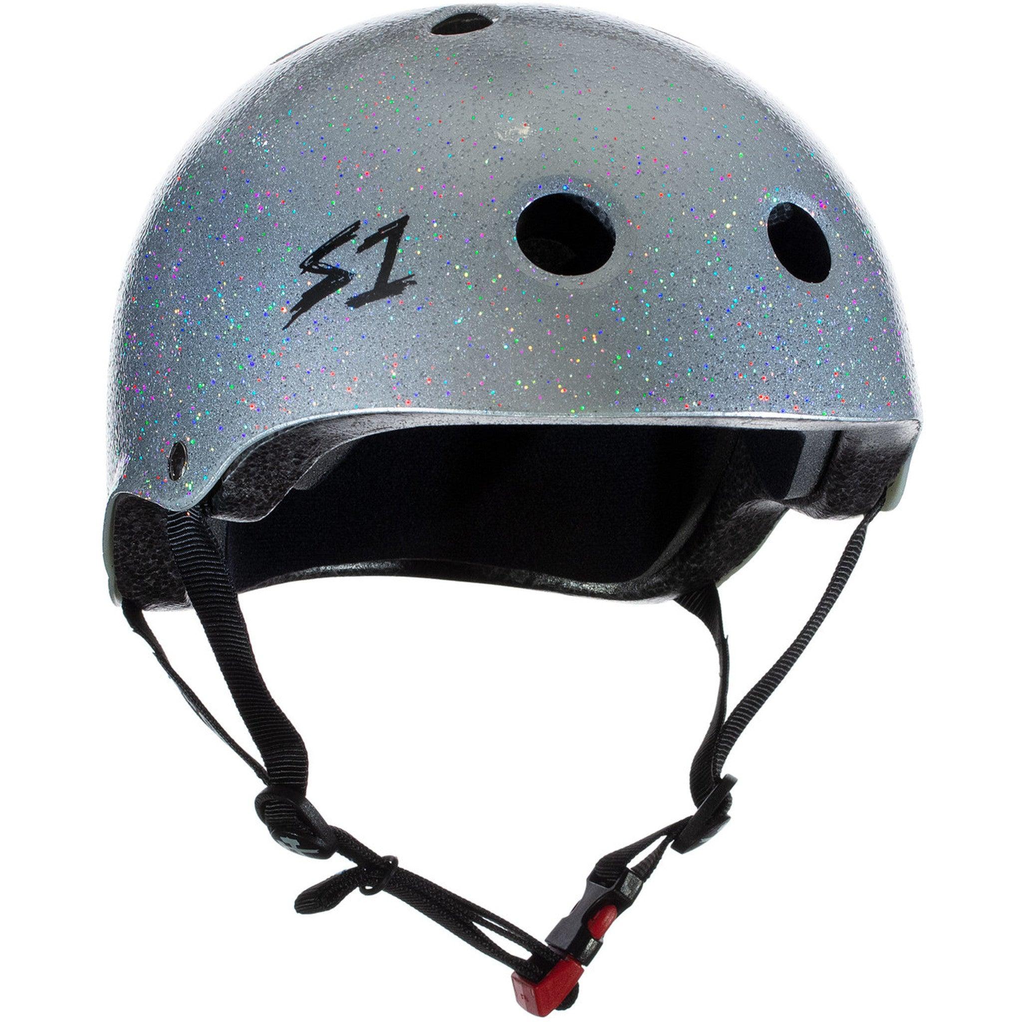 A S-One Helmet Mini Lifer Silver Gloss Glitter with a black interior padding, featuring the logo "S1". It incorporates EPS Fusion Foam for multi-impact protection, multiple ventilation holes, and an adjustable chin strap with a red buckle.