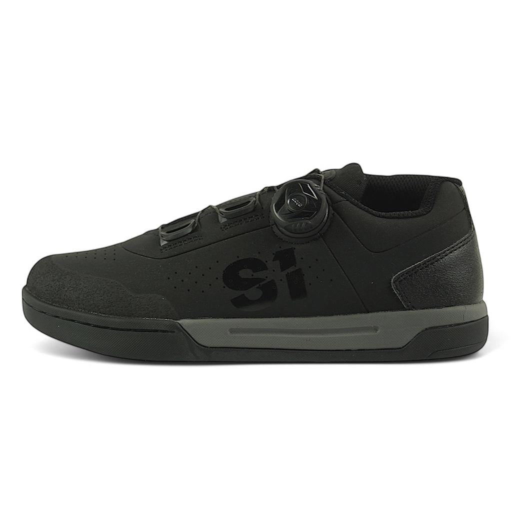 The S1 Accel Race Shoes are black BMX shoes with a low profile, triple side dials, a flat textured sole for grip, and a subtle black "S1" logo.