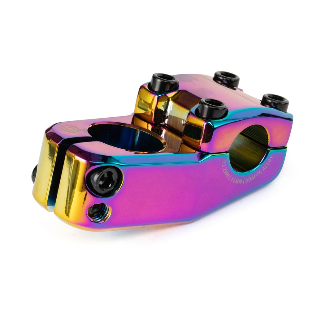 The Salt AM 45 Top Load Stem is a metallic alloy stem with a rainbow-like iridescent finish, specifically designed for 18-inch bikes. It features Shark Tooth Clamping and multiple screws for secure attachment.