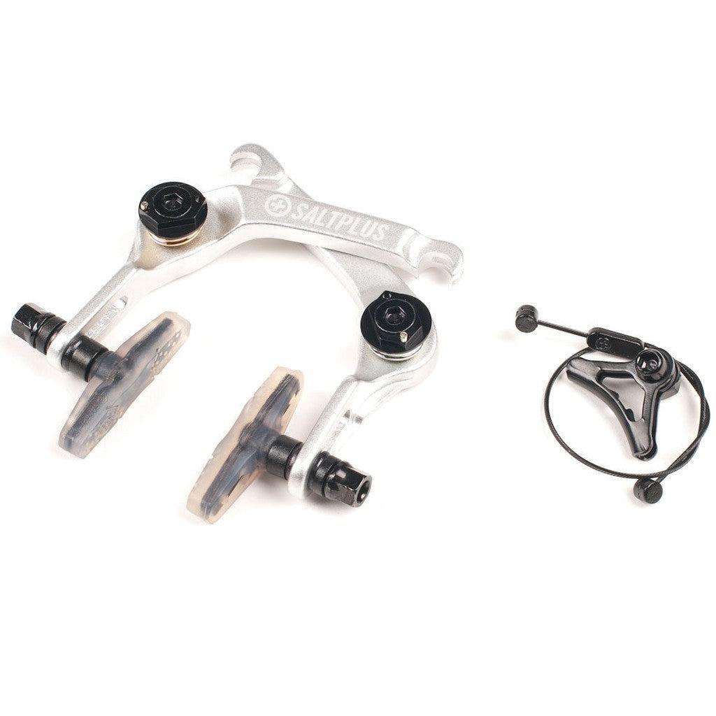 The Salt Plus Echo U-Brake features a silver rear caliper with black tension adjustment screws and brown alloy brake pads, and it comes with a separate black cable hanger.