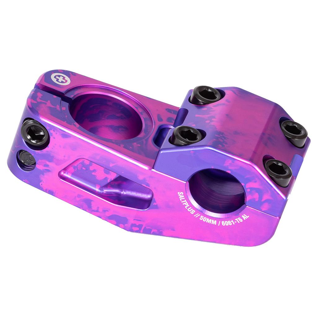 The Salt Plus Manta Top Load Stem, made from robust 6061-T6 alloy, features a glossy purple and pink finish and multiple bolt holes. Its Shark Tooth Clamping offers a secure fit for BMX riding.