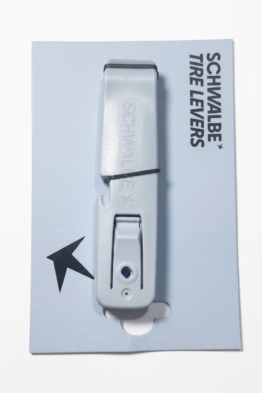 A package of Schwalbe Tire Levers, consisting of two blue plastic levers stacked together on a branded backing card—an essential tool for effortless bicycle tire removal.