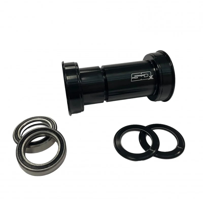 The SD BB386 Spinning Ceramic Bottom Bracket 24mm, with two ceramic bearings and two black spacers, is displayed on a white background.