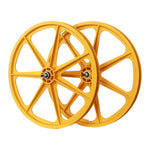 Two yellow Skyway Tuff II 24 inch 7 Spoke Wheels with black mag wheel design on a white background.