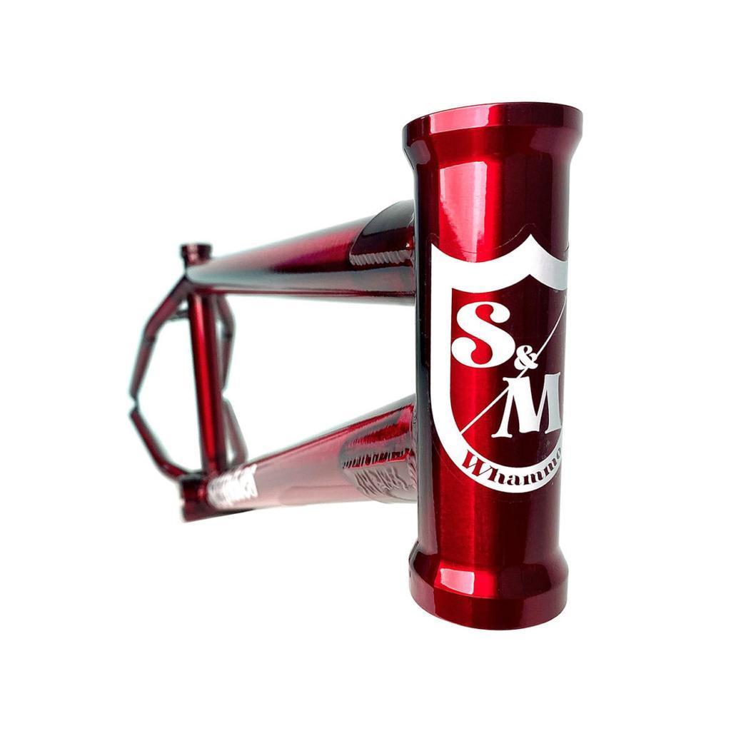 Close-up of the red S&M Whammo V2 (Craig Passero) Frame, featuring a higher bottom bracket for street agility and adorned with a white S&M logo.