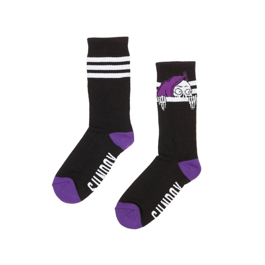 A pair of Sunday Creepy Sweeper Crew Socks with a sick skull on them.