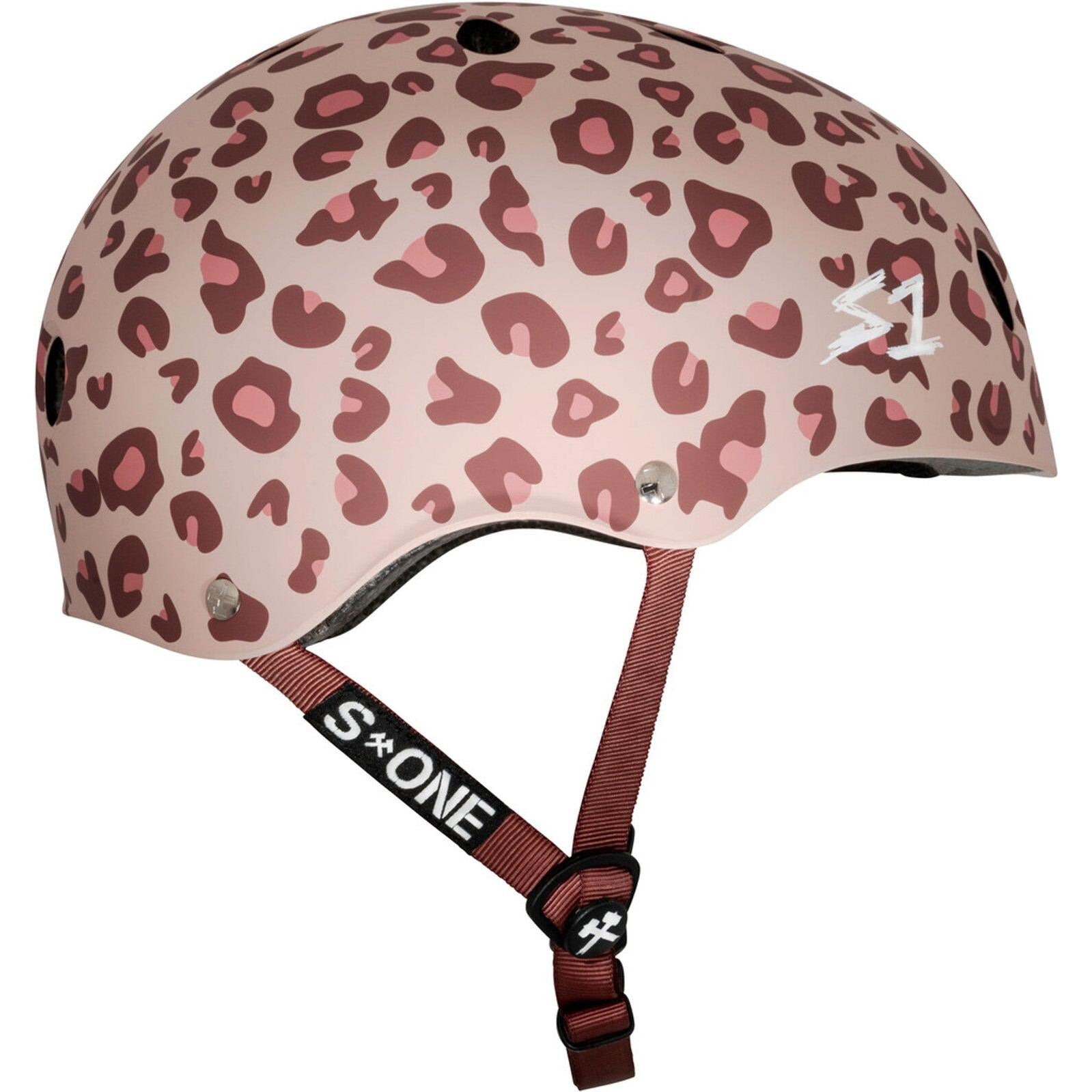The S-One Lifer Helmet / Light Pink Cheetah - Pink Helmet Posse Collab is a pink and maroon cheetah print skate helmet with ventilation holes, adjustable strap, and certified multi-impact protection for safety and style.