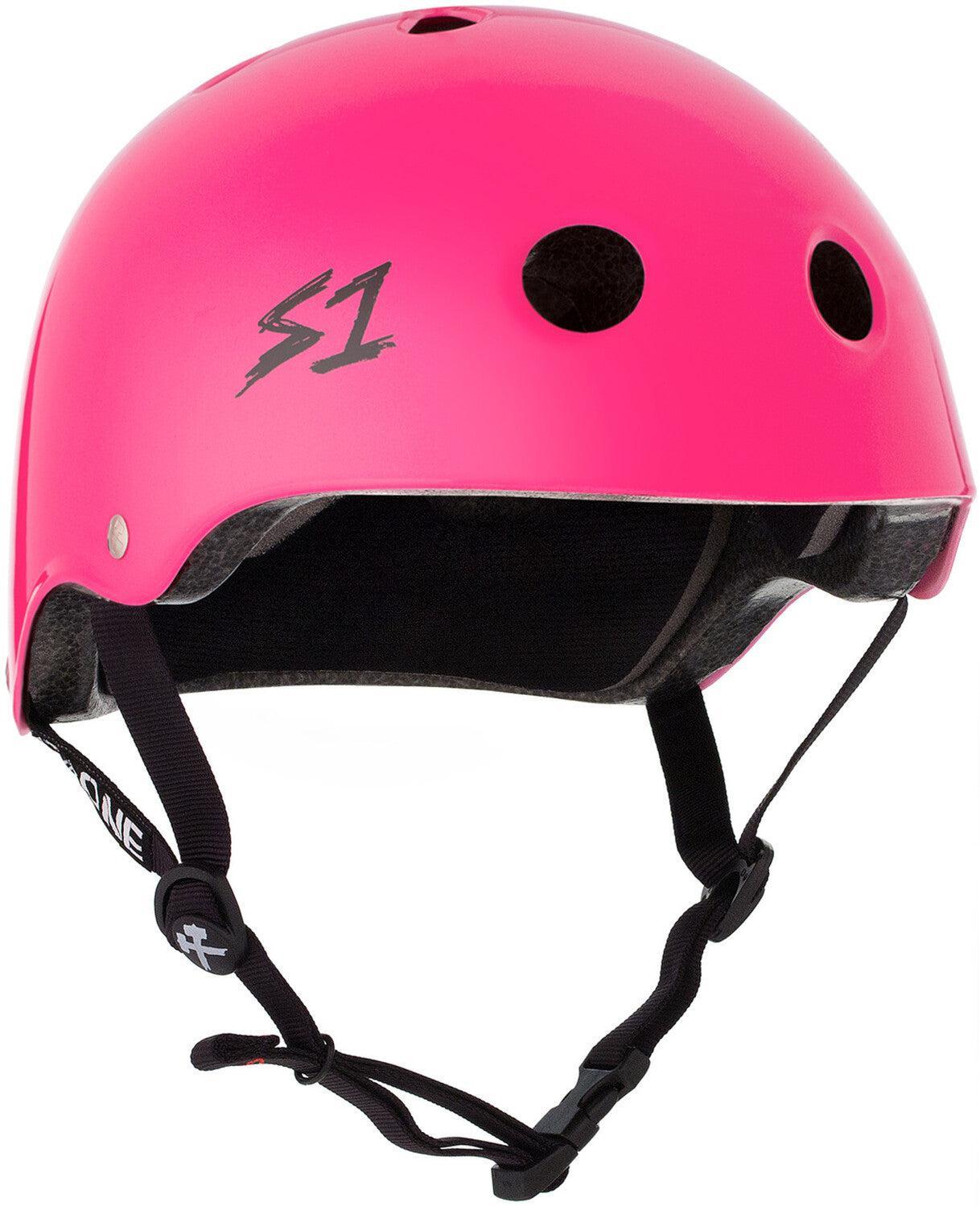 The S-One Lifer Helmet in Hot Pink Gloss features black ventilation holes, multiple impact protection, an adjustable chin strap, and an "S1" logo on the side.