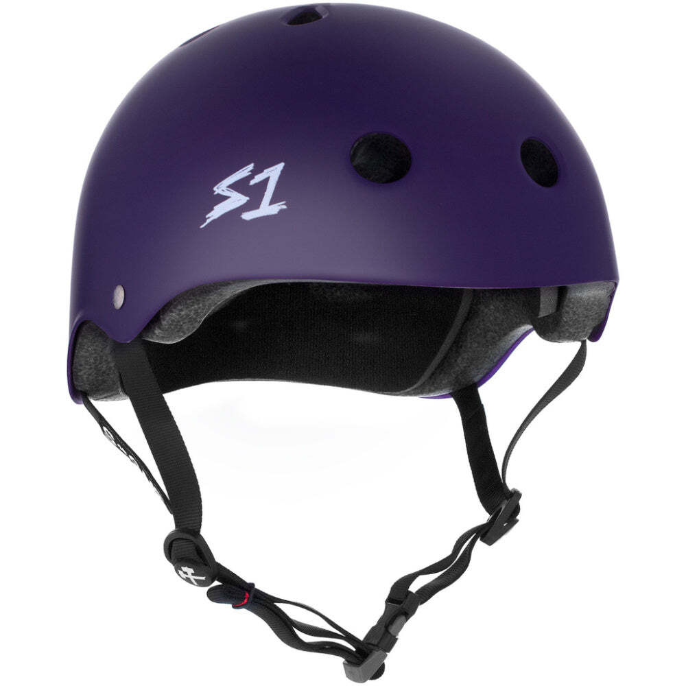 The S-One Lifer Helmet Purple Matte features ventilation holes, black adjustable straps, and a white S1 logo, providing multi-impact protection for action sports enthusiasts.