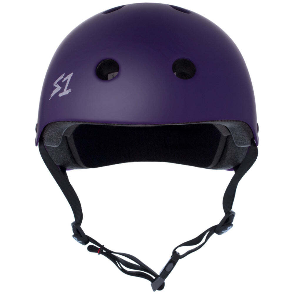 The S-One Lifer Helmet in Purple Matte is a certified skate helmet with multi-impact protection, ventilation holes, black lining, and an adjustable chin strap, shown from the front.