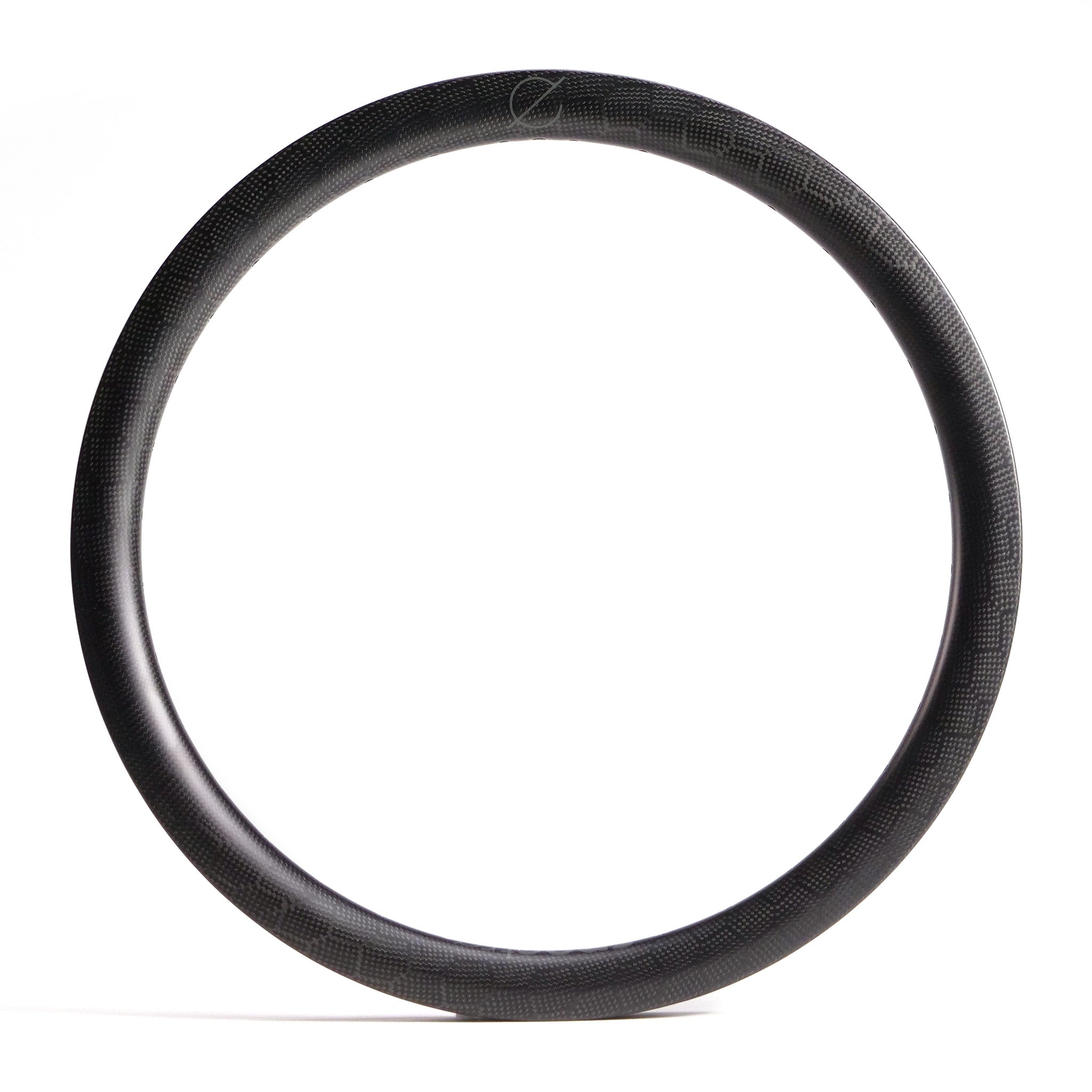 The Spectre V2 Carbon Fiber 20 Inch 36H Brakeless Rim, in black, is displayed against a white background, highlighting its strong and lightweight design.