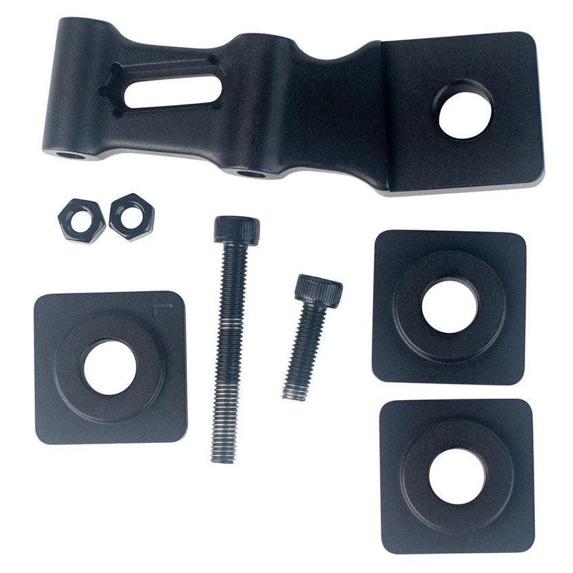 Four black metal bracket pieces—one featuring a slotted opening and three with centered circular holes—are displayed on a white background. These components are included in the Speedco EVO Disc Mount Calliper and Dropout Spacer Kit, which is compatible with the Speedco EVO Pro dropout and commonly used for mounting a disc brake caliper.