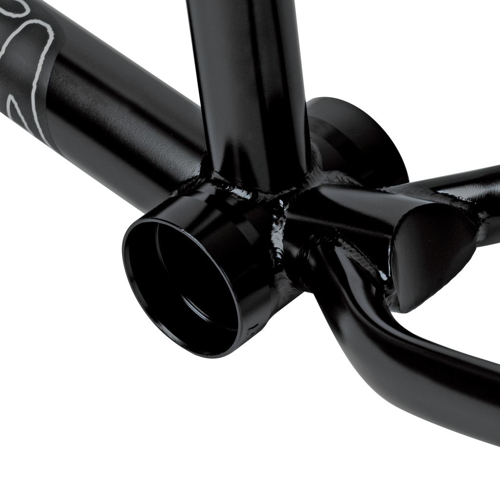 Close-up of the bottom bracket area of a black Stranger Royale Frame, showcasing the precise welds, part of the crank arm, and durable Japanese Chromoly tubing.