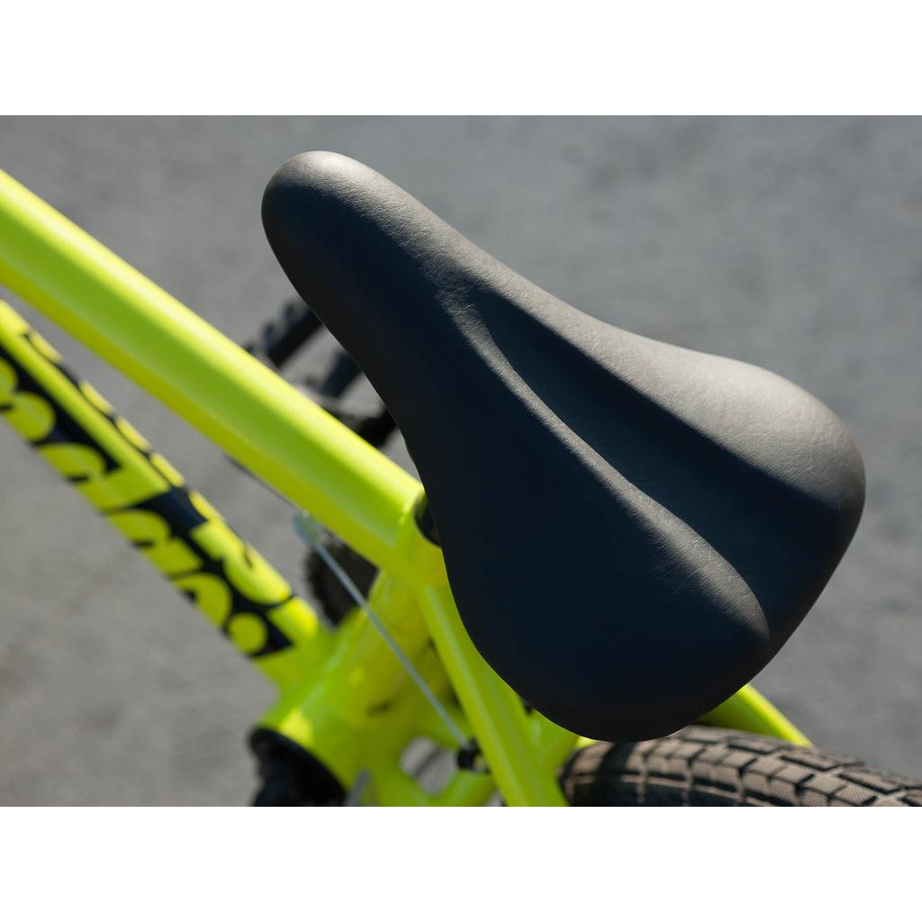 Close-up of the black seat on the Sunday Blueprint 16 Inch Bike's yellow frame, highlighting its scaled-down geometry for comfort. The rear tire and Odyssey Springfield Brakes are also visible.