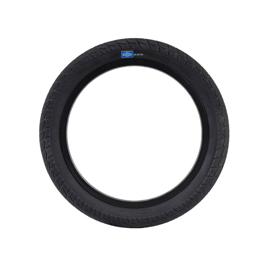 A Sunday Current 18 Inch Tyre with a textured tread pattern, ideal for beginner riders, viewed from the side against a white background.