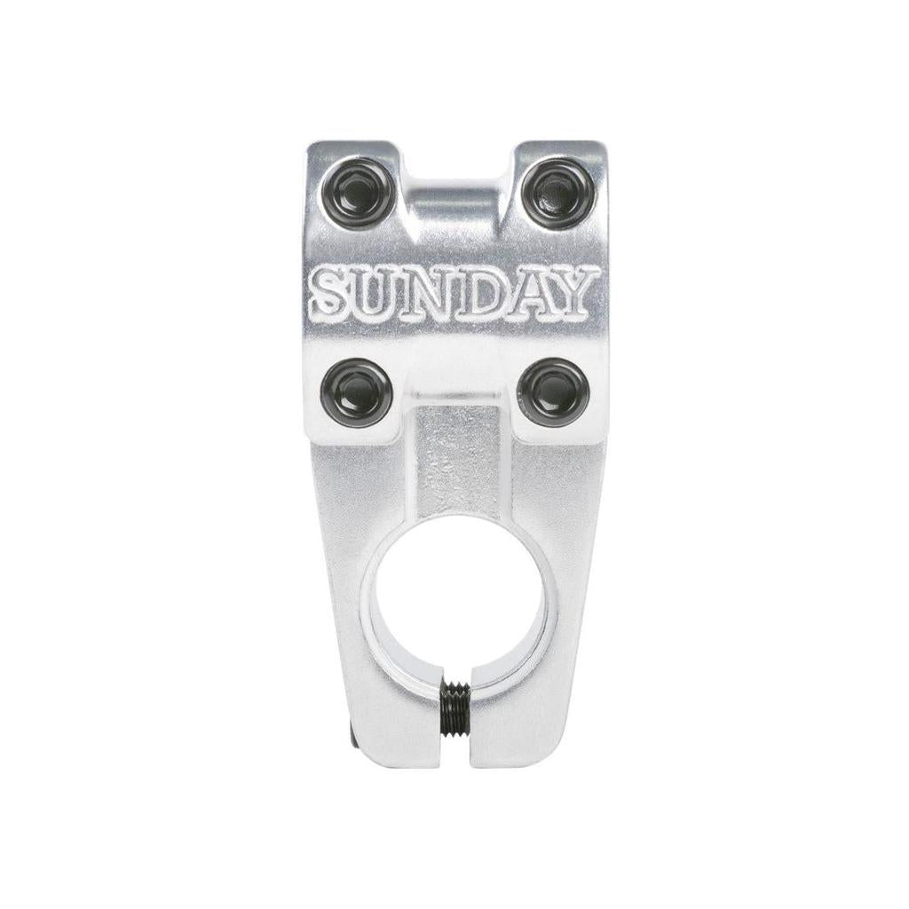 The sleek Sunday Freeze T/L Stem, made from die-cast aluminum, has "Sunday" engraved. It features a top-load design with four black bolts and a central circular opening for easy attachment.