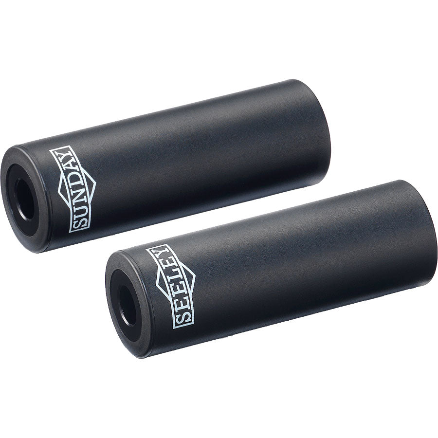 A pair of Sunday Jake Seeley Pegs with a proprietary plastic sleeve.