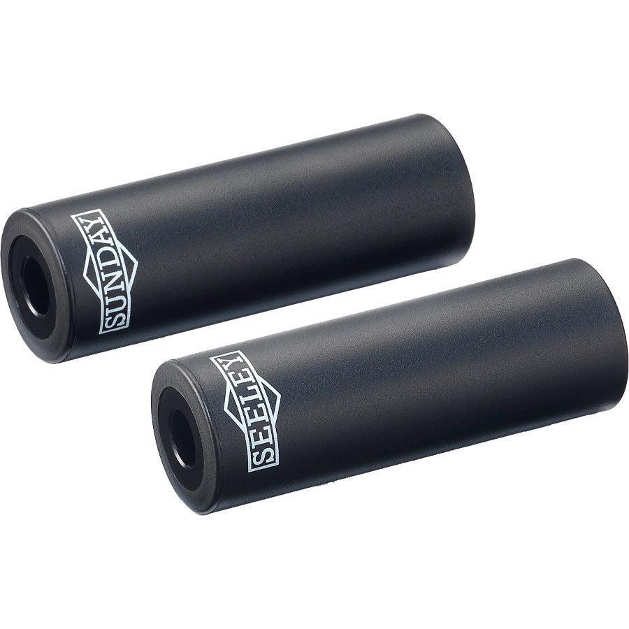 A pair of Sunday Jake Seeley Pegs with a proprietary plastic sleeve.