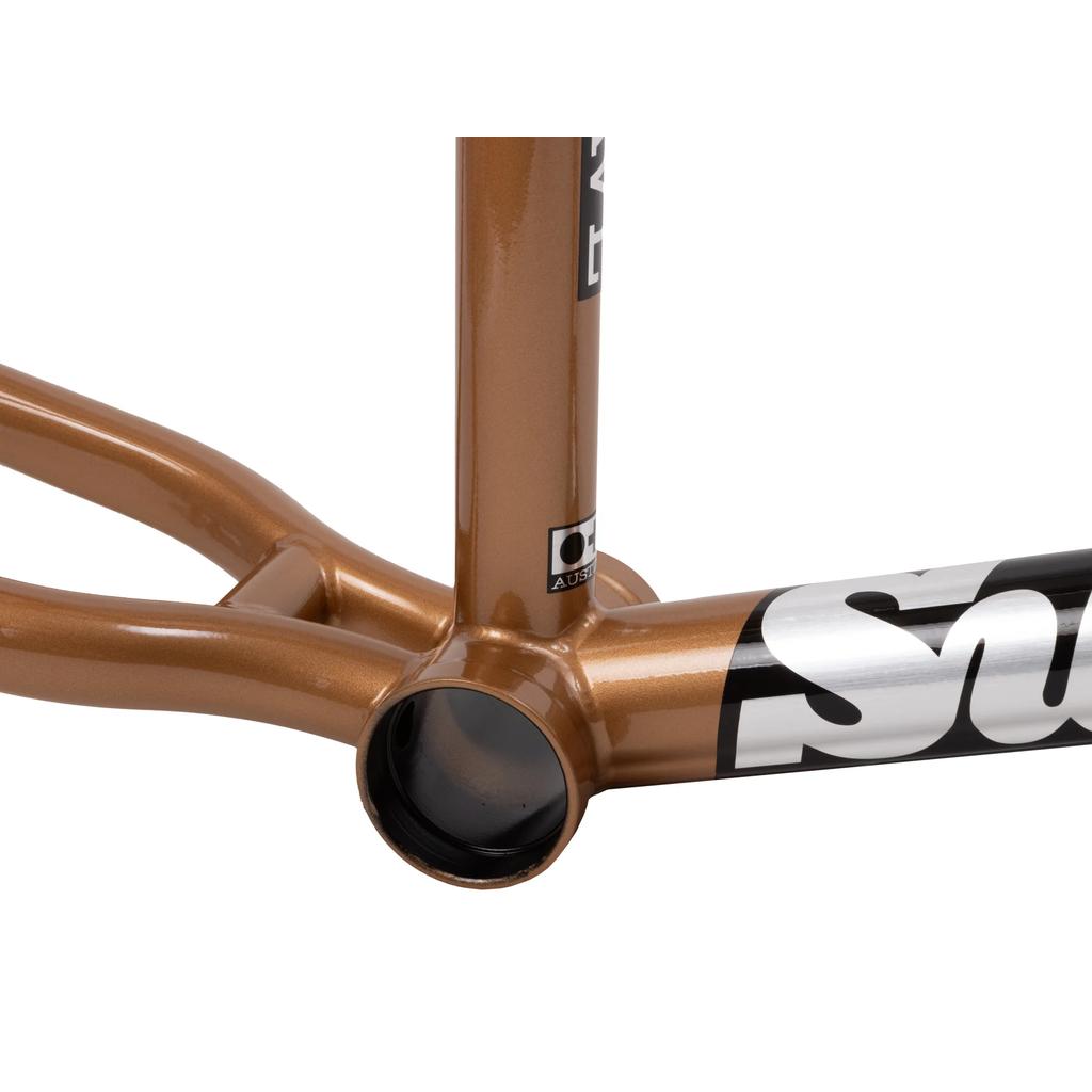 Close-up of the Sunday Silvawave Frame (Brett Silva Signature) in metallic bronze chromoly, highlighting the bottom bracket shell and partial black-and-white decals.