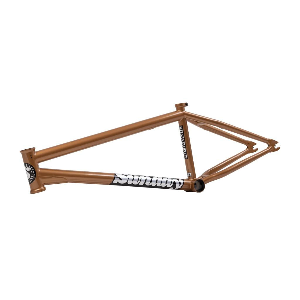 The Sunday Silvawave Frame (Brett Silva Signature) is a bronze-colored BMX frame with "Sunday" branding on the downtube, made from durable chromoly, and displayed on a white background.