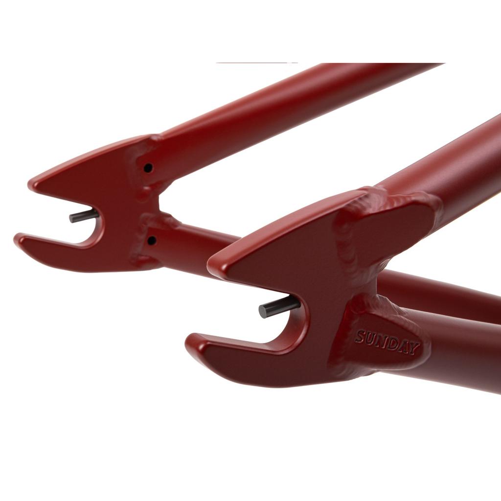 Close-up of the rear dropouts and axle on the red Sunday Soundwave V3 Frame, featuring "SUNDAY" embossed on its 4130 Chromoly build and covered by a 41-Thermal Lifetime Warranty.
