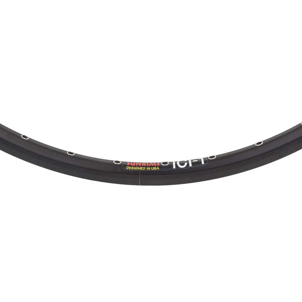 Close-up of a Sun ICI-1 24 x 1-1/8" 36H (520mm) Black double wall bicycle rim segment with multiple spoke holes and a "DESIGNED IN USA" label, ideal for 24 inch BMX setups.