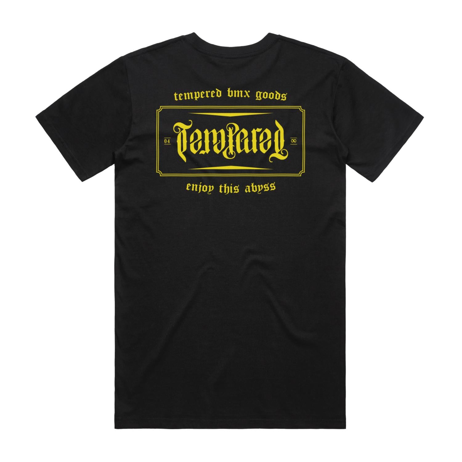 The Tempered Goods Crest T-Shirt showcases a black design with a yellow outlined box and the word "Tempered" in a stylized font. It features the text “Tempered BMX Goods” above and “Enjoy this abyss” below, honoring Aussie legends with this unique piece.