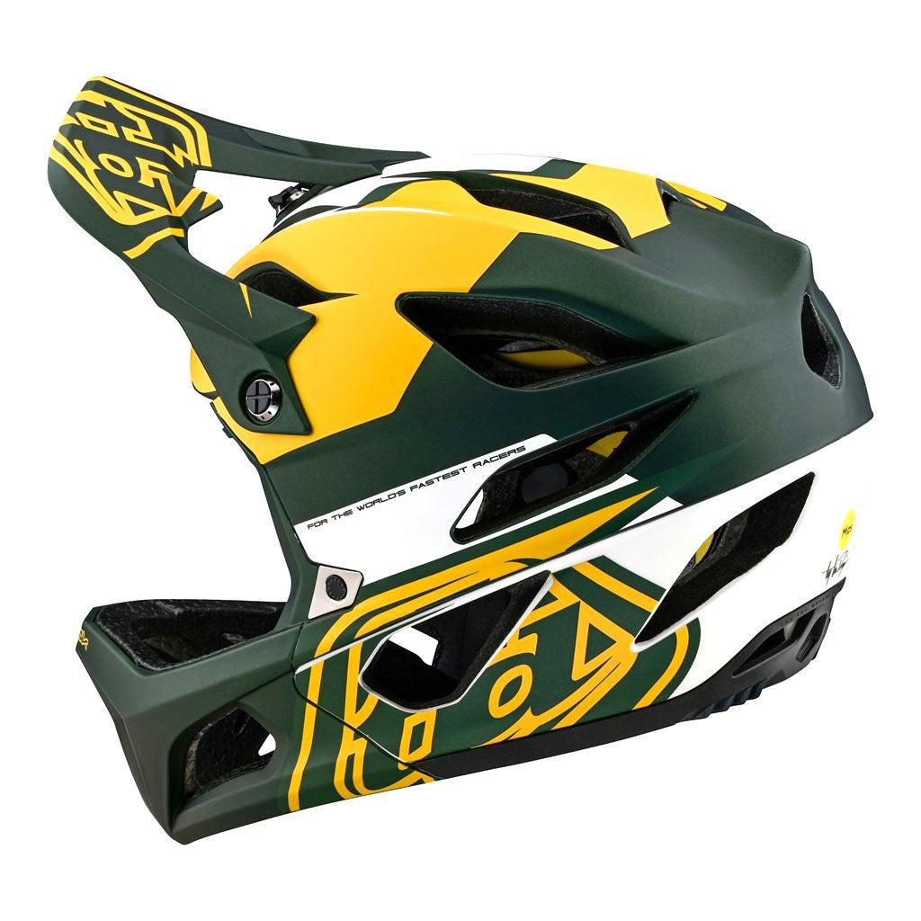 Side view of the TLD 24.1 STAGE MIPS AS Helmet, showcasing a green and yellow design with visor and MIPS technology.