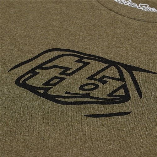 Close-up of the TLD 25.1 Badge SS T-Shirt in olive green with a striking black abstract geometric design.
