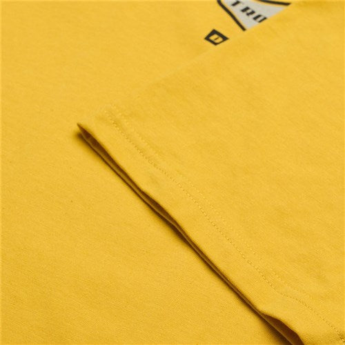 Close-up of a folded TLD 25.1 Carb SS T-shirt in yellow, highlighting stitching details and a printed design, ideal for fans who want to sport TLD loud and proud.