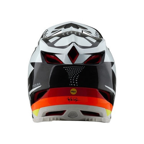 The TLD 25.1 D4 Carbon Helmet (MIPS) in Optic Black features a black and white design with red and orange accents, ideal for downhill BMX. It highlights angular designs, rear vents, and prominently displays the MIPS logo at the bottom.