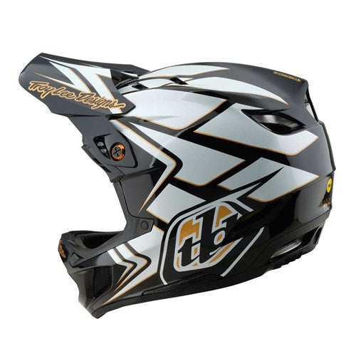 The TLD 25.1 D4 Composite Helmet (MIPS) in Ghostwing White features a sleek aerodynamic design with geometric patterns and text. Made from durable D4 Composite materials, it offers Mips C2 protection for safer downhill BMX adventures.