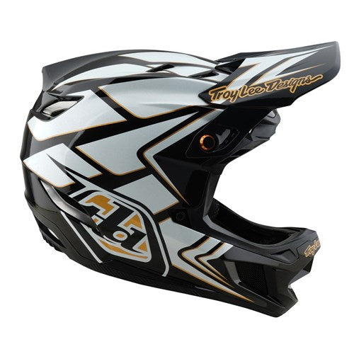 The Ghostwing White TLD 25.1 D4 Composite Helmet (MIPS) features geometric patterns and "Troy Lee Designs" on the visor. Ideal for downhill BMX fans, this black-and-white full-face helmet provides both style and protection.