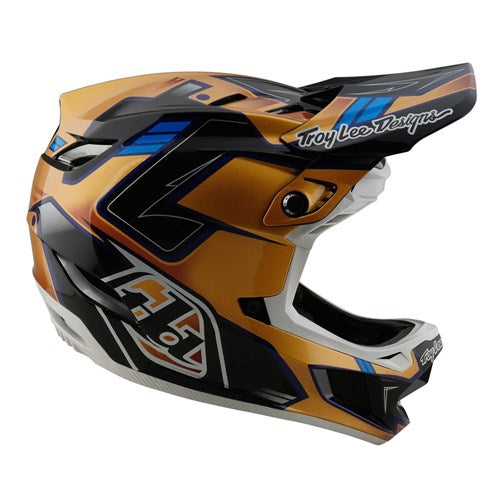 The TLD 25.1 D4 Composite Helmet (MIPS) in Royalty Black/Gold is a full-face helmet with visor and angular accents, designed for downhill motocross enthusiasts. It offers MIPS protection for safety, and the stylish brand name is displayed on the side.