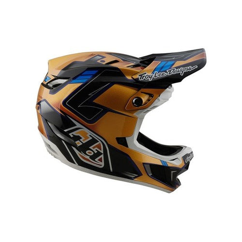 The TLD 25.1 D4 Composite Helmet (MIPS) in Royalty Black/Gold is a full-face helmet with visor and angular accents, designed for downhill motocross enthusiasts. It offers MIPS protection for safety, and the stylish brand name is displayed on the side.