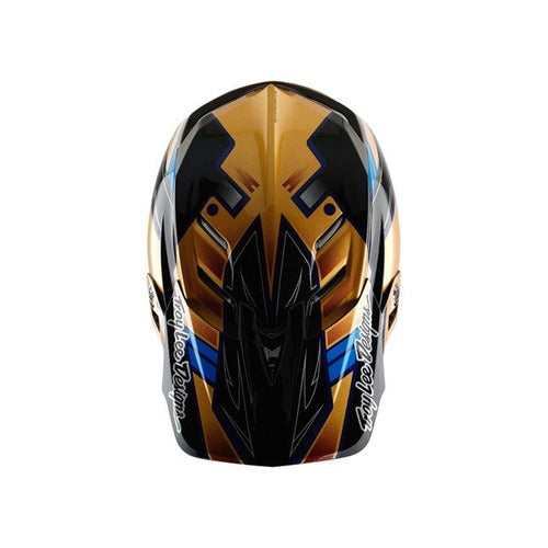 Front view of the vibrant TLD 25.1 D4 Composite Helmet (MIPS) in Royalty Black/Gold, showcasing intricate geometric designs with "Troy Lee Designs" on the sides, offering enhanced safety through MIPS protection.