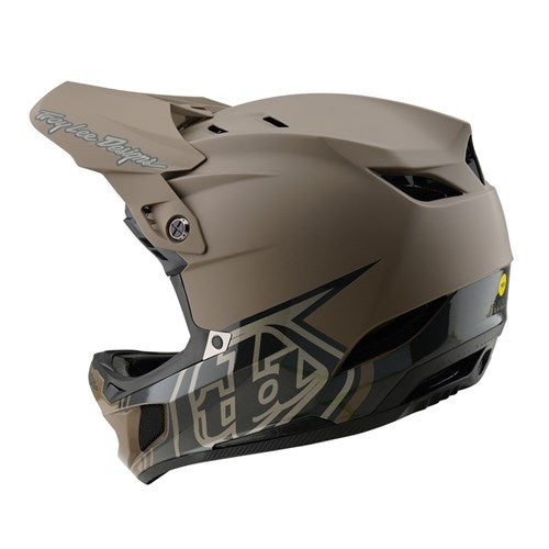 The TLD 25.1 D4 Composite Helmet (MIPS) / Stealth Caper is a matte brown and black downhill helmet with a visor, offering ventilation slots and MIPS protection for enhanced safety.