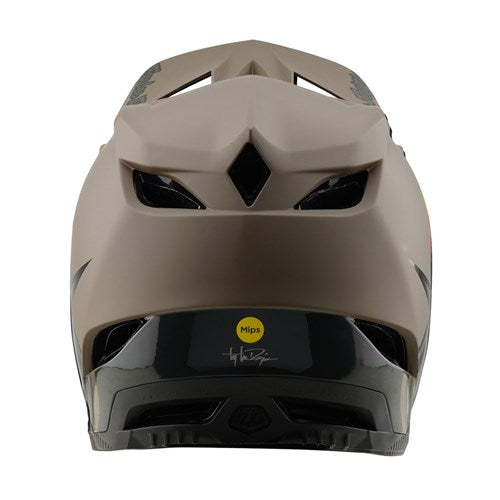 The TLD 25.1 D4 Composite Helmet (MIPS) in Stealth Caper offers a tan and black design with ventilation slots and the MIPS logo, ideal for anyone needing downhill helmet safety.