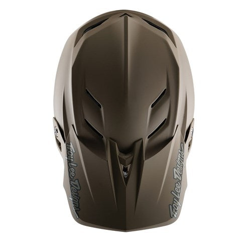 A top view of the TLD 25.1 D4 Composite Helmet (MIPS) in Stealth Caper shows its aerodynamic design with a black logo on the sides, enhanced with MIPS protection for added safety.
