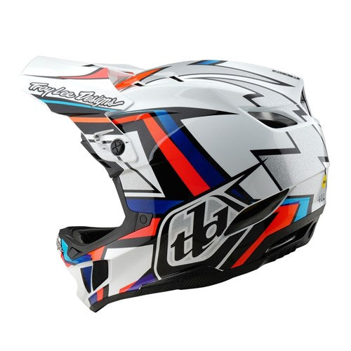 The TLD 25.1 D4 Composite Helmet (MIPS) in white/silver shows a side view with sharp red, blue, and black designs. It includes a visor, branded logos, and MIPS Protection for enhanced safety on downhill adventures.
