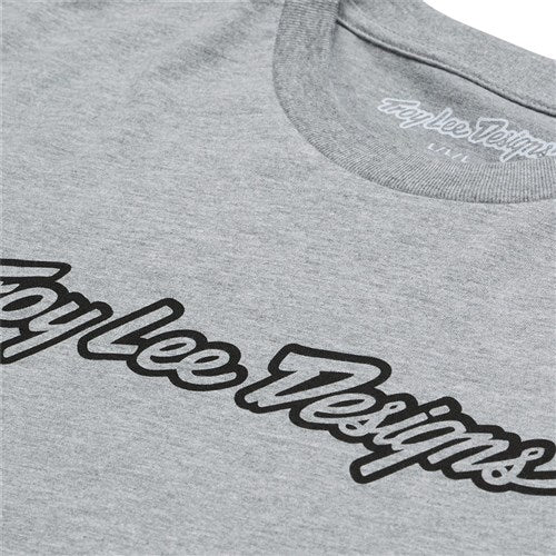 Close-up of the TLD 25.1 Signature SS T-Shirt: a gray tee featuring the "Troy Lee Designs" logo in bold, black script on the front.