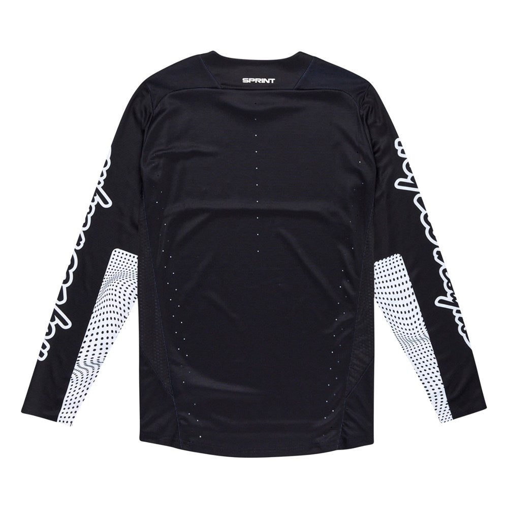 The TLD 25.1 Sprint Jersey / Mono Black is a black long-sleeve race jersey by Troy Lee Designs, featuring white graphics on both sleeves and small ventilation holes on the back for breathability.
