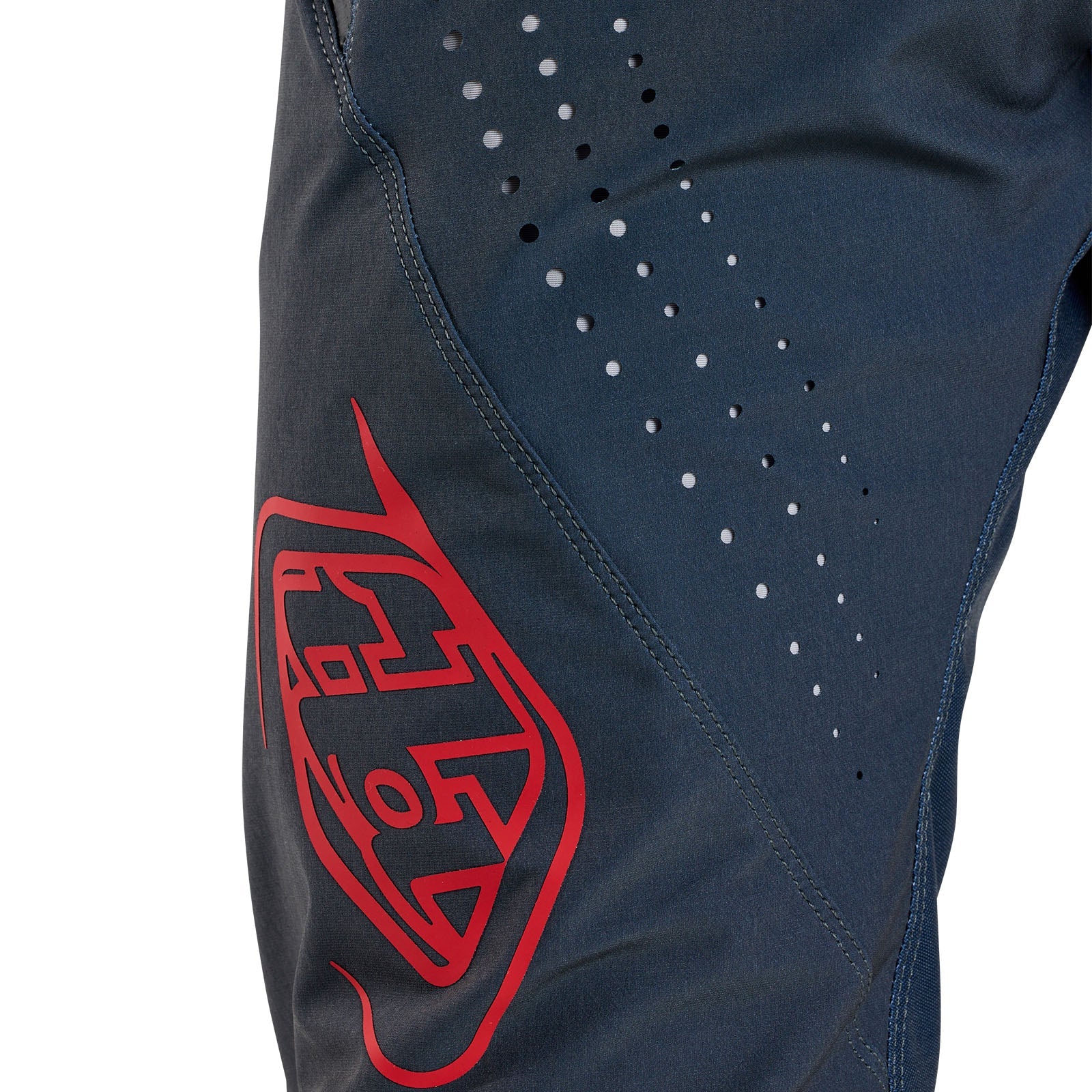 Close-up of the TLD 25.1 Sprint Pant / Mono Steel Blue with a red logo and side perforations, ideal for a race-ready look.