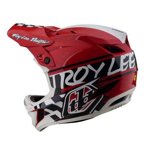 The TLD D4 Polyacrylite Helmet (MIPS) Fifty-50 White/Red, ideal for downhill BMX, boasts a bold red and white design with black geometric patterns and features "Troy Lee" on the side.