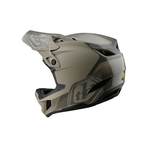 The TLD D4 Polyacrylite Helmet (MIPS) / Shadow Timber is a matte-finish, full-face motorcycle helmet with a polyacrylite shell, angular gray and black design, a prominent visor, MIPS brain protection technology, and a sleek side logo.