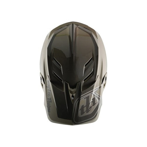 The TLD D4 Polyacrylite Helmet (MIPS) / Shadow Timber offers a top view of a dark, glossy full-face motocross helmet with ventilation slits and an angular design, enhanced with Mips brain protection for added safety.