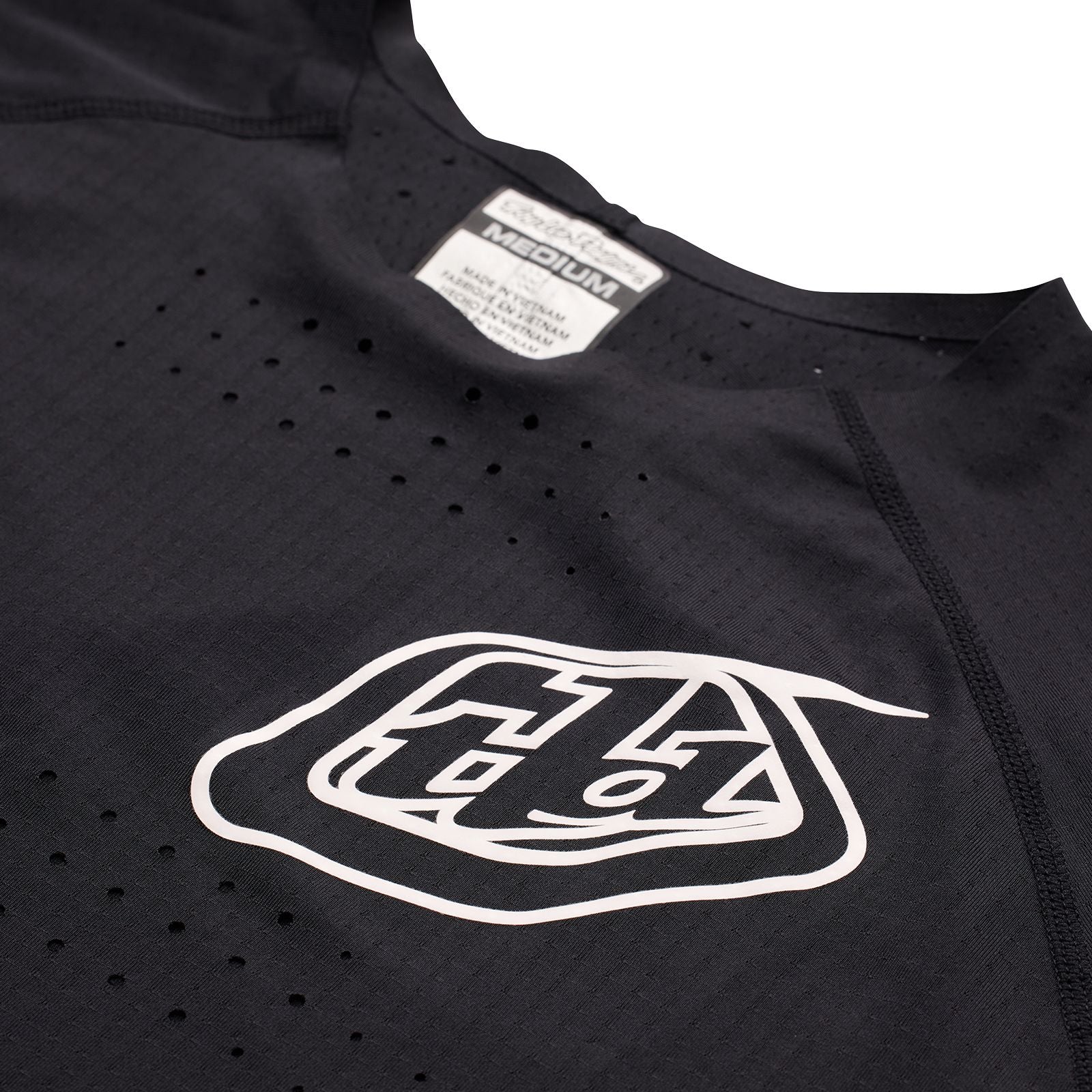 A black TLD Sprint Ultra Jersey Mono Black with a white logo on it.