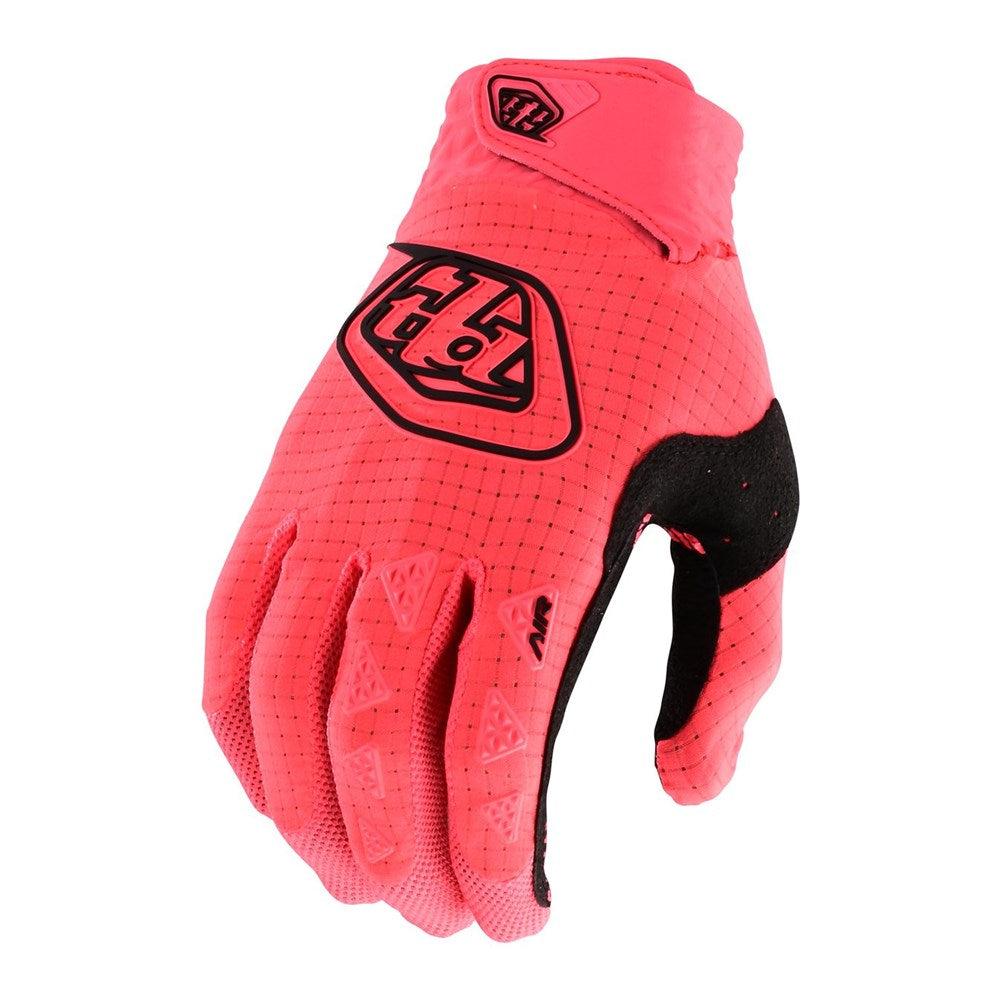 The TLD Youth Air Glove Glo Red features striking red and black geometric patterns with the Troy Lee Designs logo, making it a standout choice for young mountain bikers seeking both style and performance.
